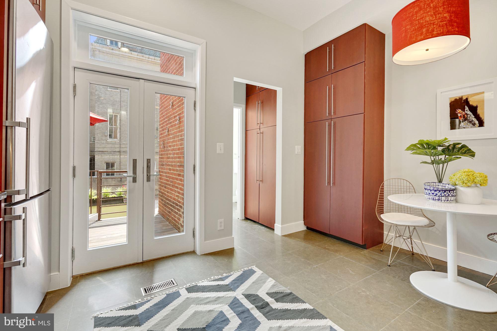 1830 Corcoran Street Northwest Washington, DC 20009 - Photo 6 of 20 Eat-in kitchen leads to powder room & laundry