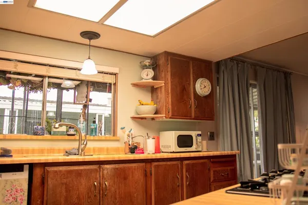 a kitchen with a sink and a window