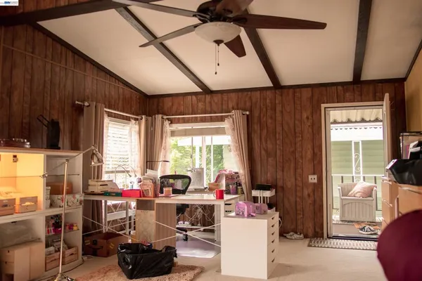 a room with gym equipment and a large window