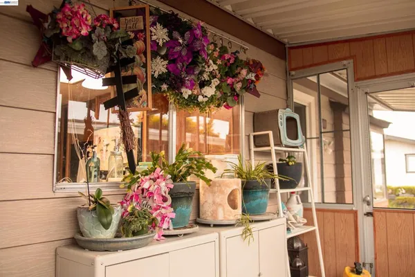 a view of walk in closet with clothes