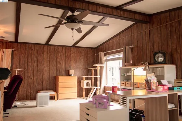 a bedroom with furniture and a window