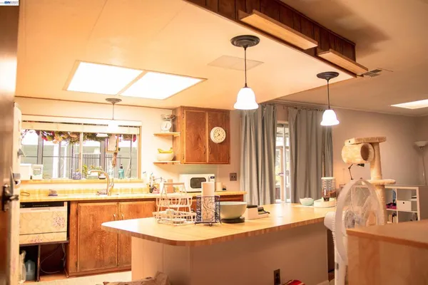 a dining table with chairs and chandelier