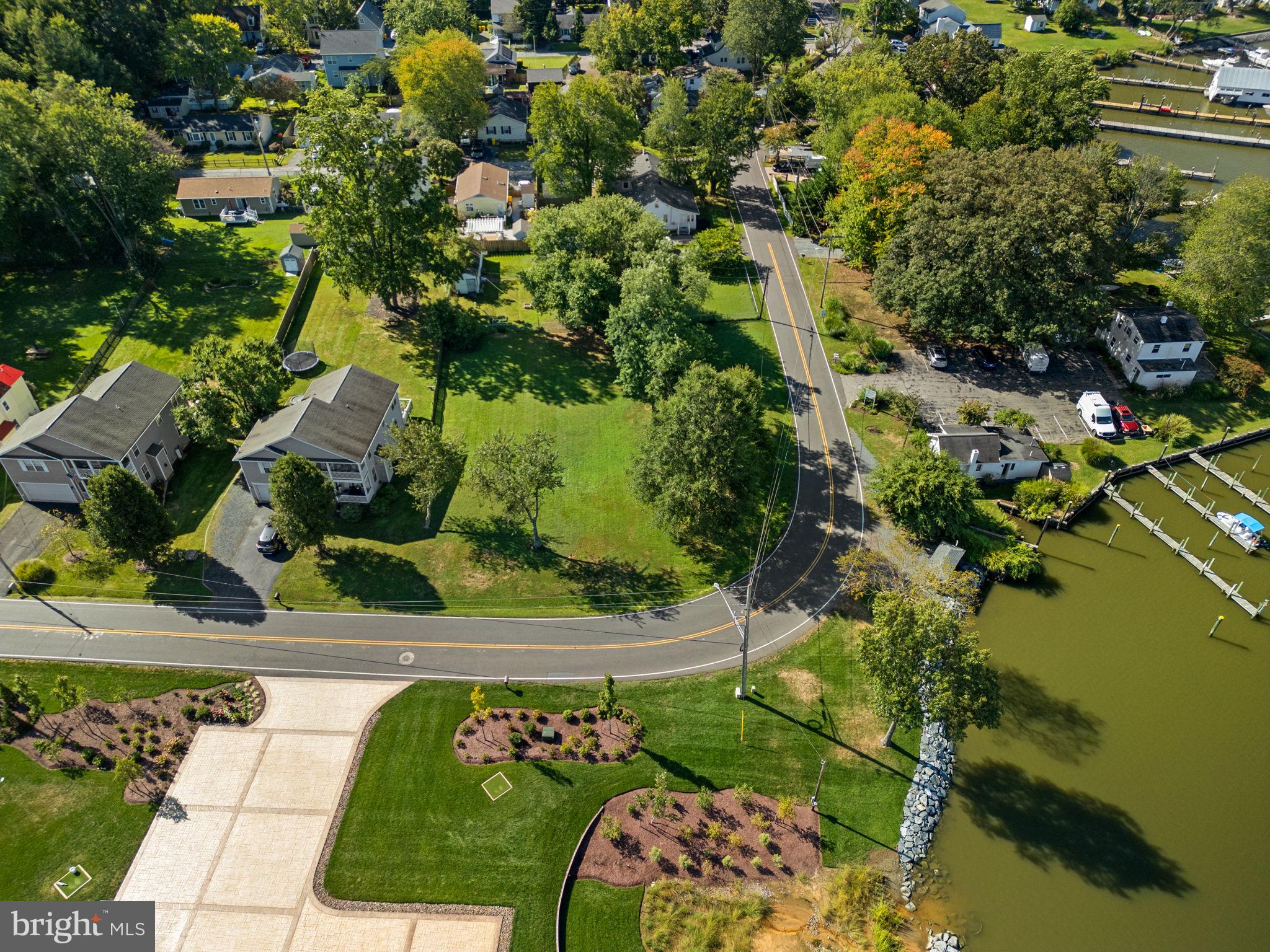 6061 Drum Point Road Deale, MD 20751 - Photo 5 of 10 a view of a garden with a lake