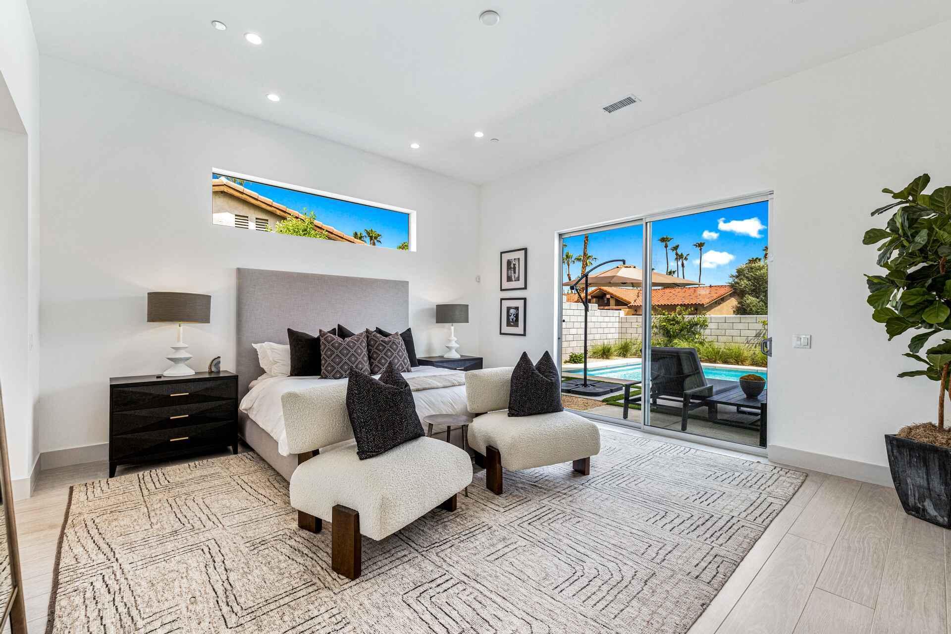 72985 Somera Road Palm Desert, CA 92260 - Photo 2 of 17 a living room with furniture and a flat screen tv