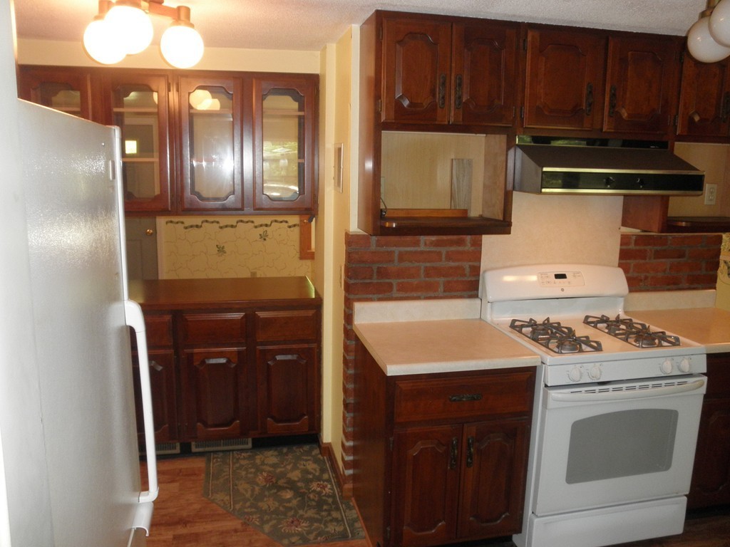 139 Southampton Road Westhampton, MA 01027 - Photo 16 of 27 a kitchen with a stove sink and cabinets