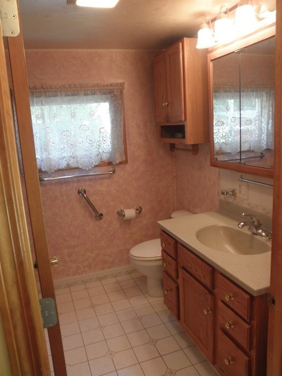 139 Southampton Road Westhampton, MA 01027 - Photo 17 of 27 a bathroom with a toilet sink and mirror