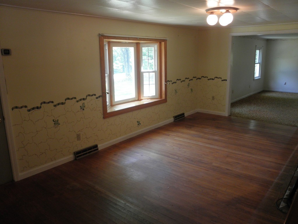 139 Southampton Road Westhampton, MA 01027 - Photo 18 of 27 an empty room with wooden floor and windows