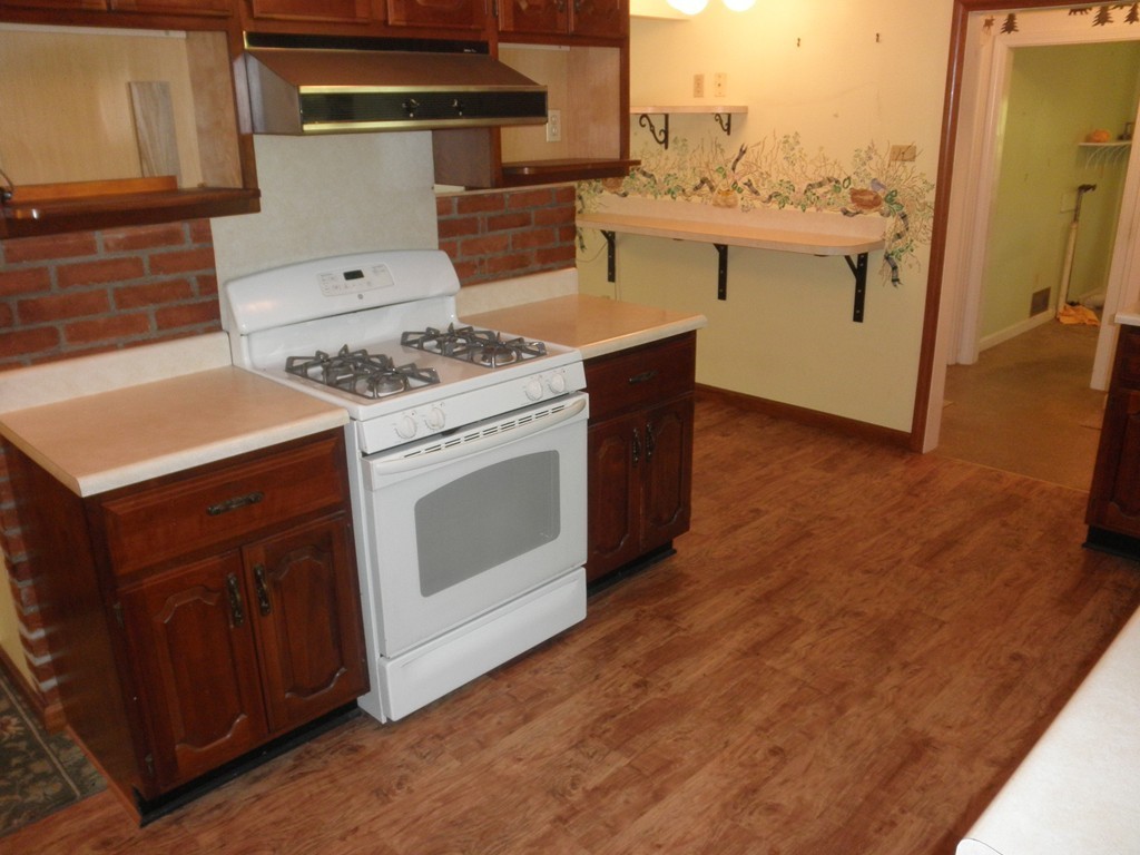 139 Southampton Road Westhampton, MA 01027 - Photo 7 of 27 a kitchen with a stove and a refrigerator