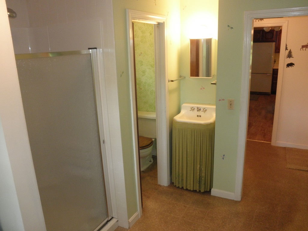 139 Southampton Road Westhampton, MA 01027 - Photo 10 of 27 a bathroom with a sink a mirror and shower