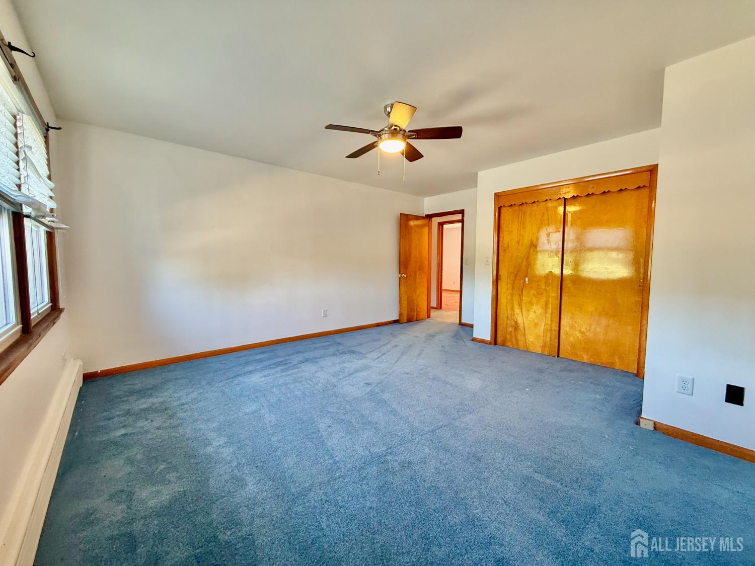 452 Cranbury Road East Brunswick, NJ 08816 - Photo 12 of 16 an empty room with windows