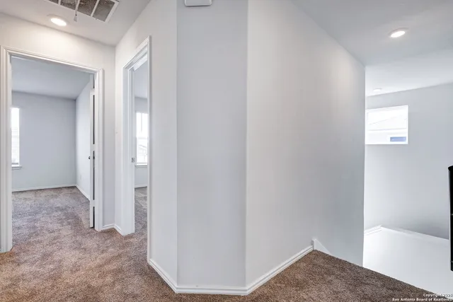 a view of a room with a hallway