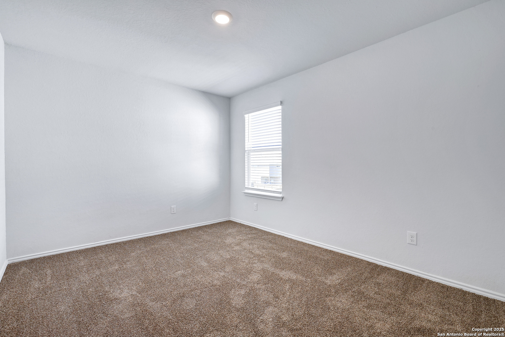 5867 Kendall Prairie San Antonio, TX 78244 - Photo 19 of 25 an empty room with a window