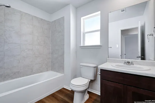 a bathroom with a sink a toilet and a bathtub