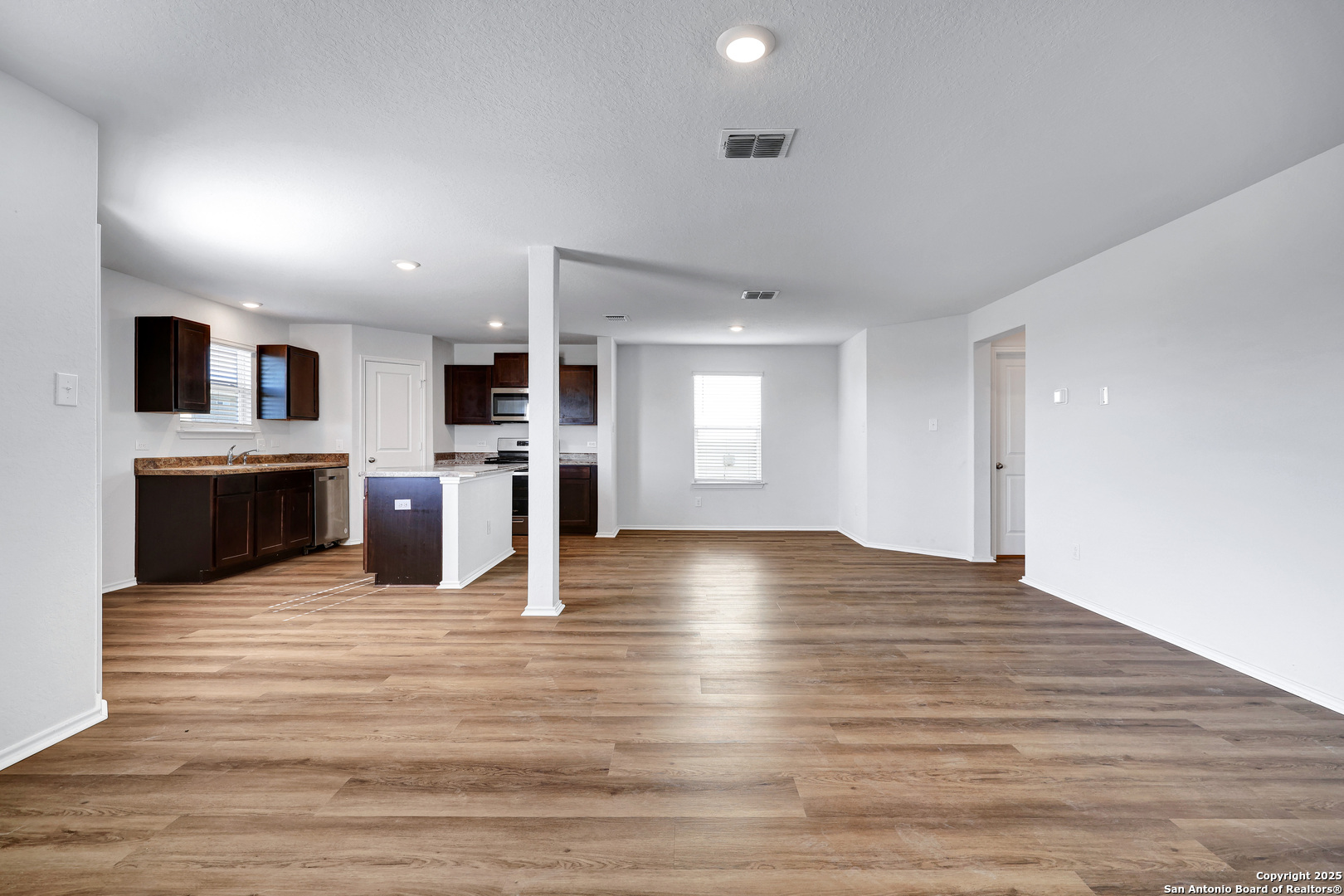 5867 Kendall Prairie San Antonio, TX 78244 - Photo 5 of 25 a view of kitchen with a sink and a fireplace