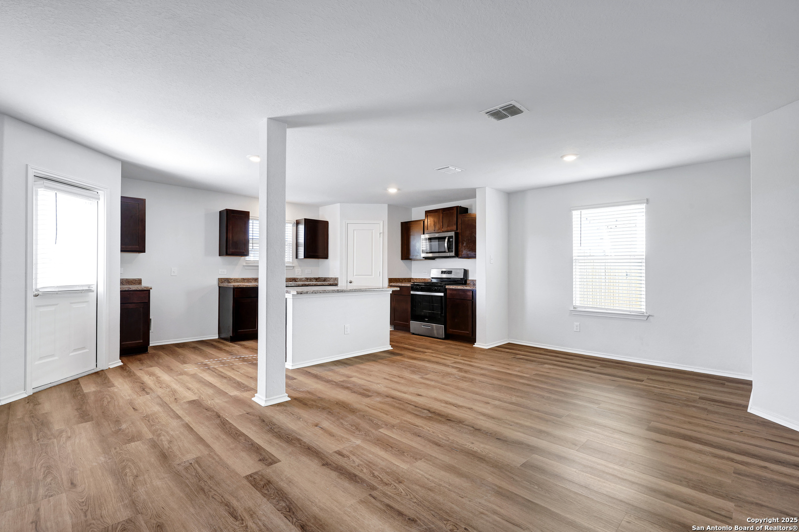 5867 Kendall Prairie San Antonio, TX 78244 - Photo 7 of 25 a view of kitchen with wooden floor