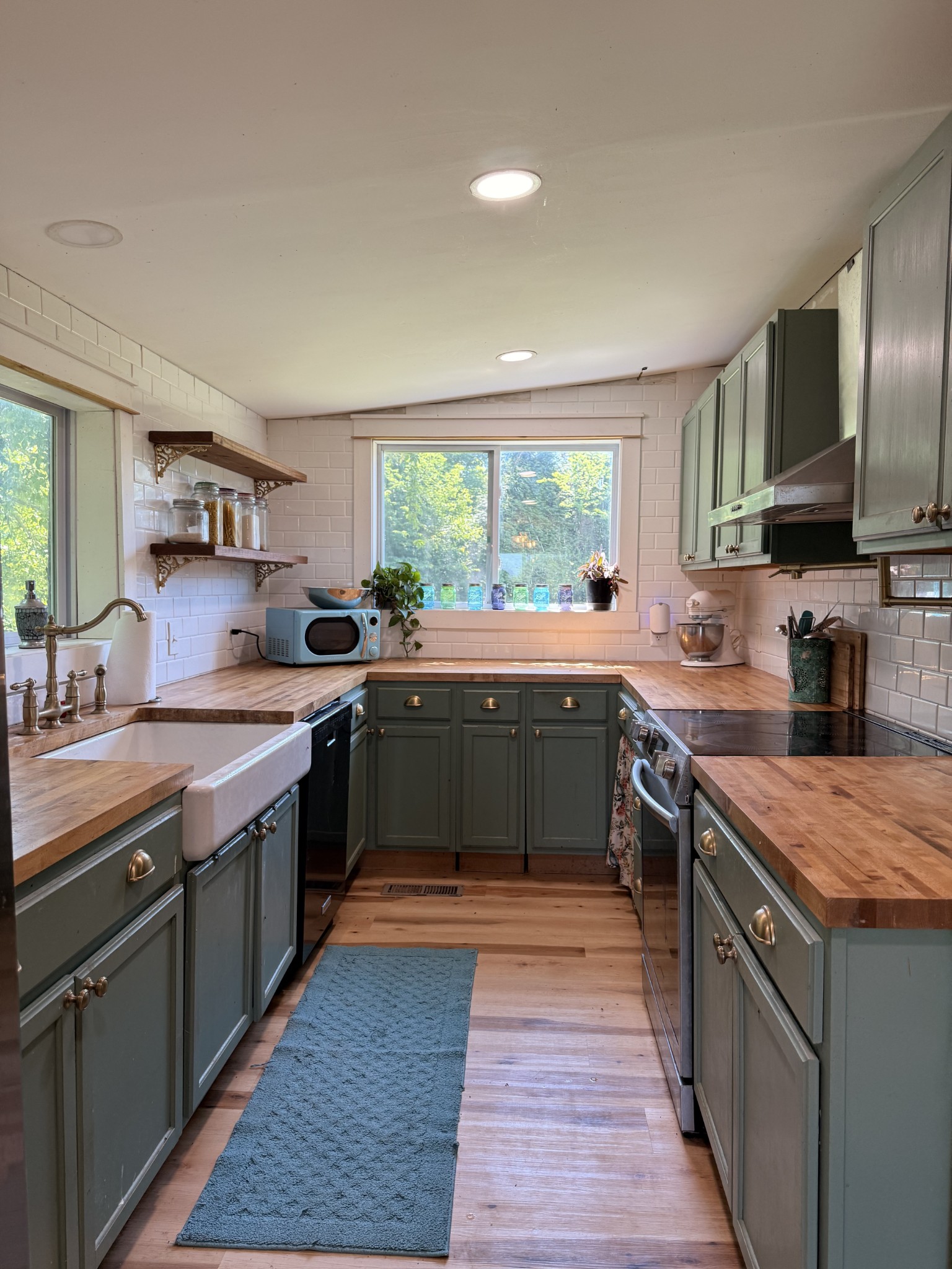 374 State Line Road Loretto, TN 38469 - Photo 11 of 24 a kitchen with a sink stove top oven and cabinets