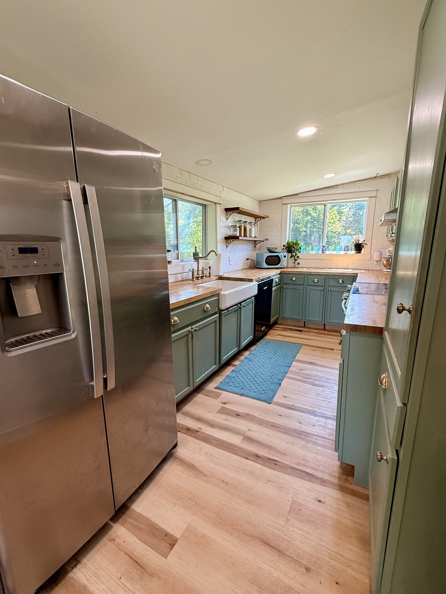 374 State Line Road Loretto, TN 38469 - Photo 12 of 24 a kitchen with stainless steel appliances a sink and a refrigerator