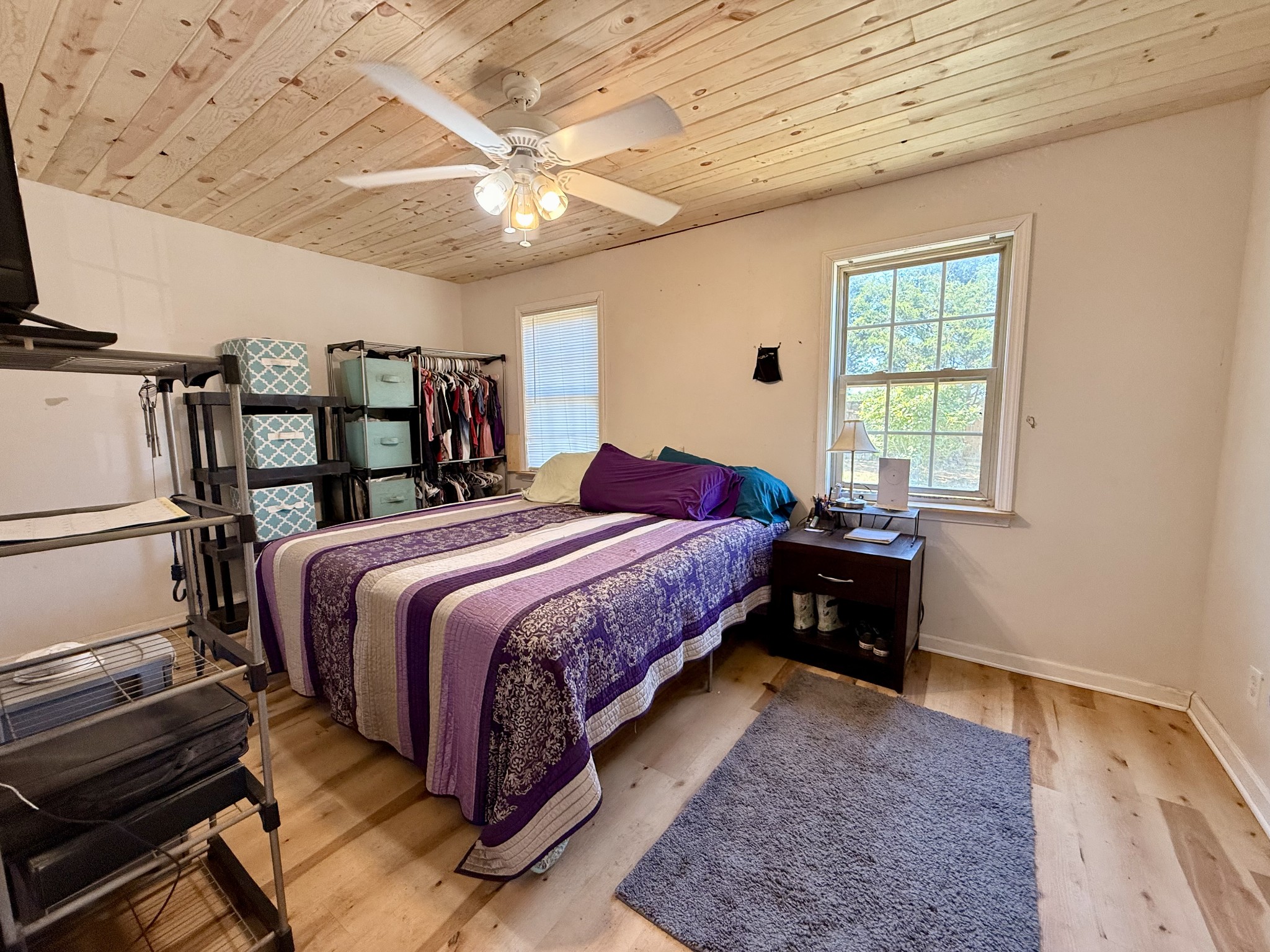 374 State Line Road Loretto, TN 38469 - Photo 14 of 24 a bedroom with a bed and a chandelier
