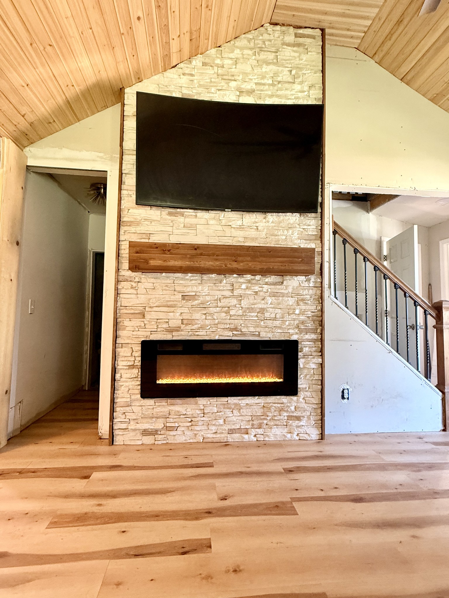 374 State Line Road Loretto, TN 38469 - Photo 3 of 24 a living room with a fireplace and a flat screen tv