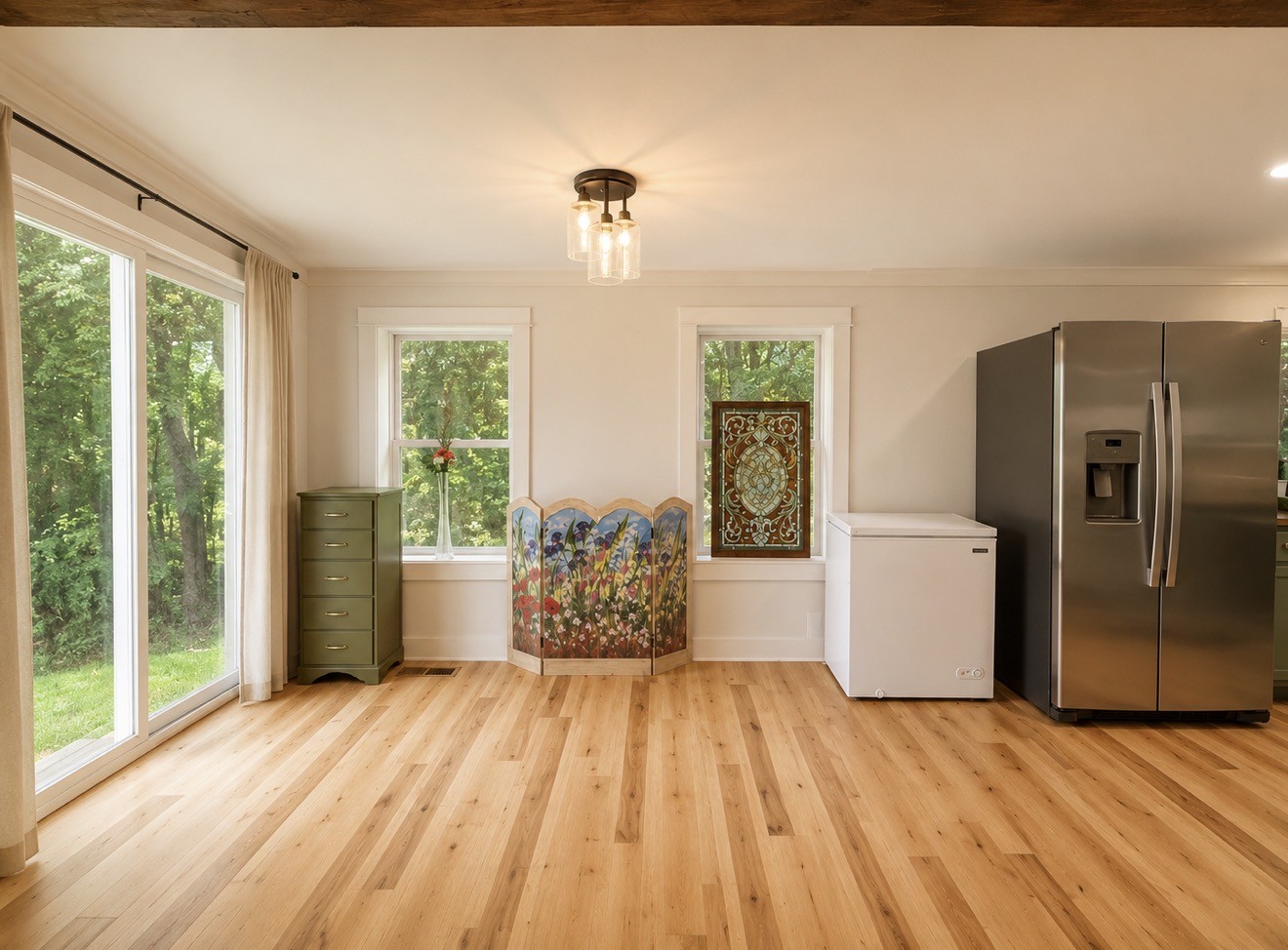 374 State Line Road Loretto, TN 38469 - Photo 4 of 24 a view of a kitchen with a fridge wooden floor and windows