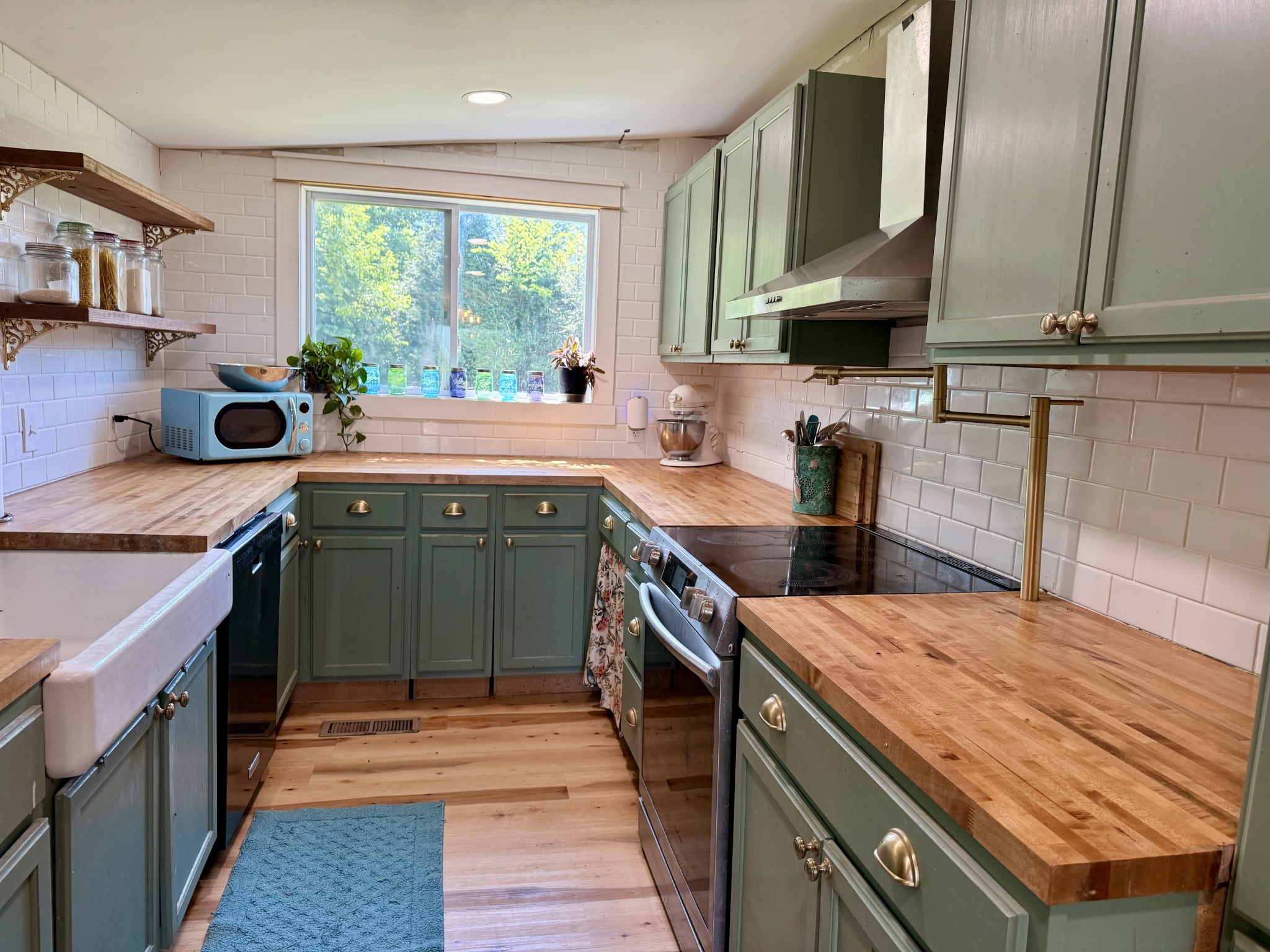 374 State Line Road Loretto, TN 38469 - Photo 5 of 24 a kitchen with a sink stove top oven and cabinets