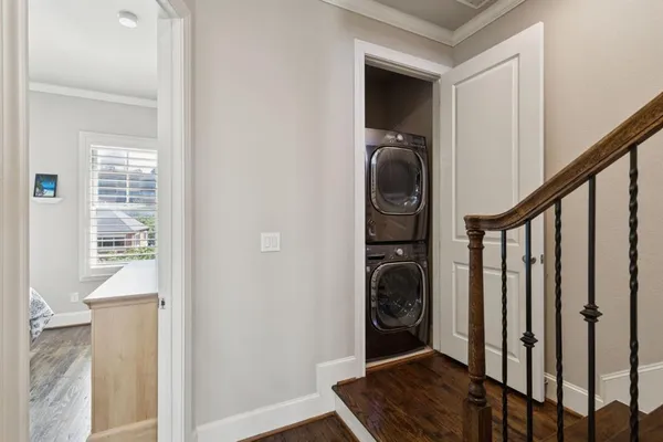a view of a bedroom with washer and dryer