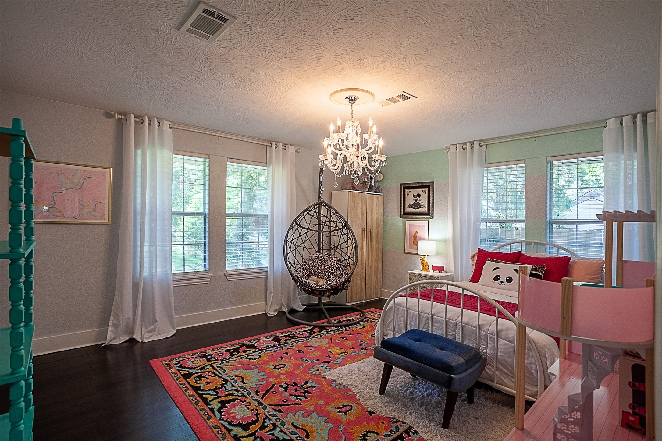 2567 65th Street Port Arthur, TX 77640 - Photo 3 of 7 a living room with furniture a chandelier and a window