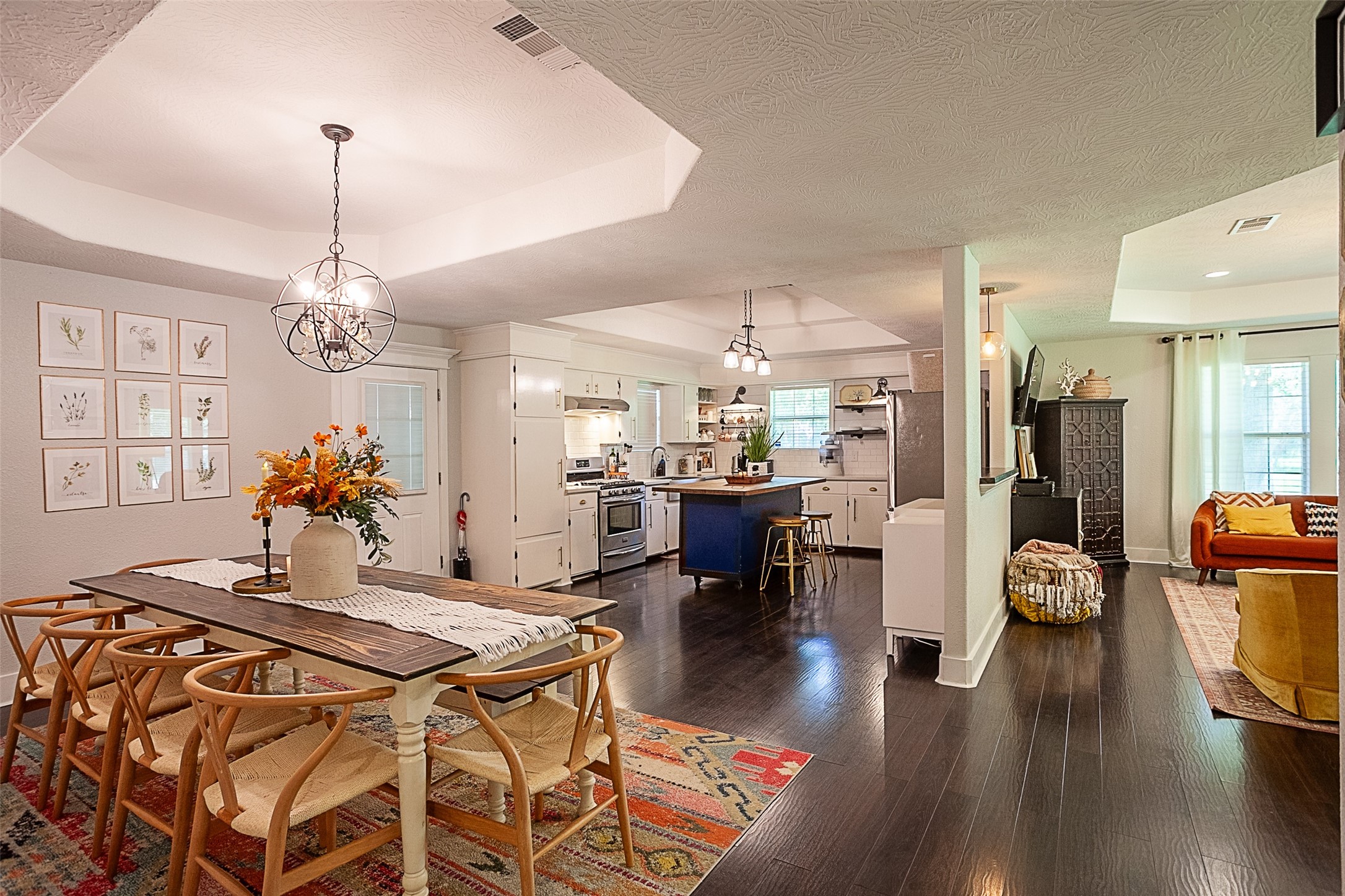 2567 65th Street Port Arthur, TX 77640 - Photo 4 of 7 a very nice looking dining room with kitchen island wooden floor and a chandelier