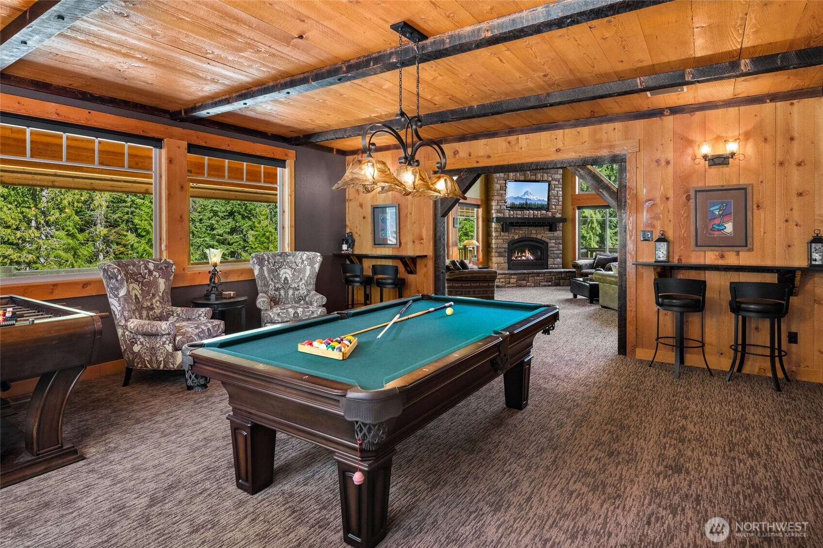 4422 Kachess Lake Road Easton, WA 98925 - Photo 16 of 36 a living room with furniture a pool table and a large window