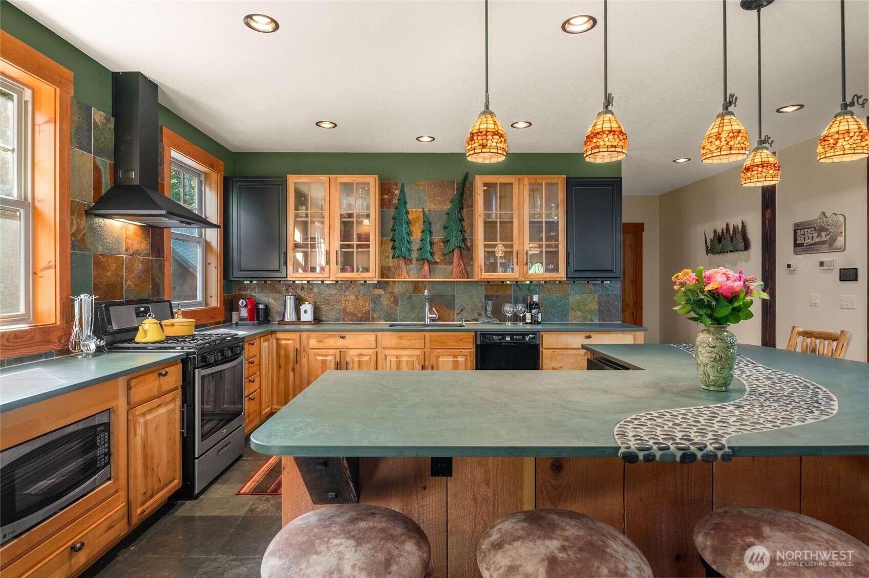 4422 Kachess Lake Road Easton, WA 98925 - Photo 18 of 36 a view of a kitchen with granite countertop a table chairs and a living room