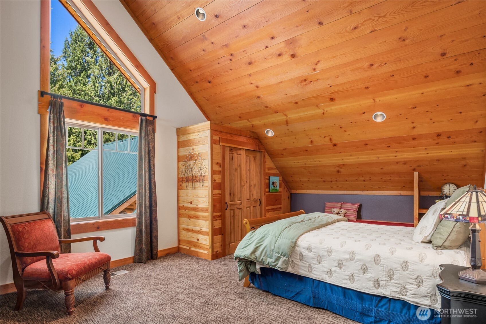 4422 Kachess Lake Road Easton, WA 98925 - Photo 22 of 36 a bed room with a bed and chair