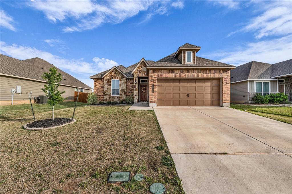7008 Llano Drive China Spring, TX 76633 - Photo 2 of 26 a front view of a house with a yard
