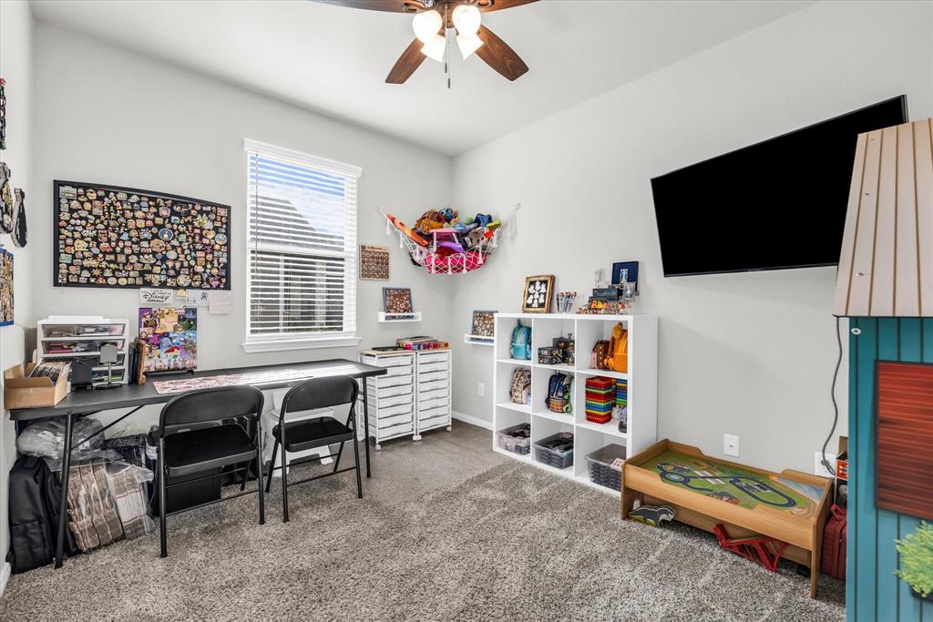 7008 Llano Drive China Spring, TX 76633 - Photo 23 of 26 a living room with furniture and a flat screen tv