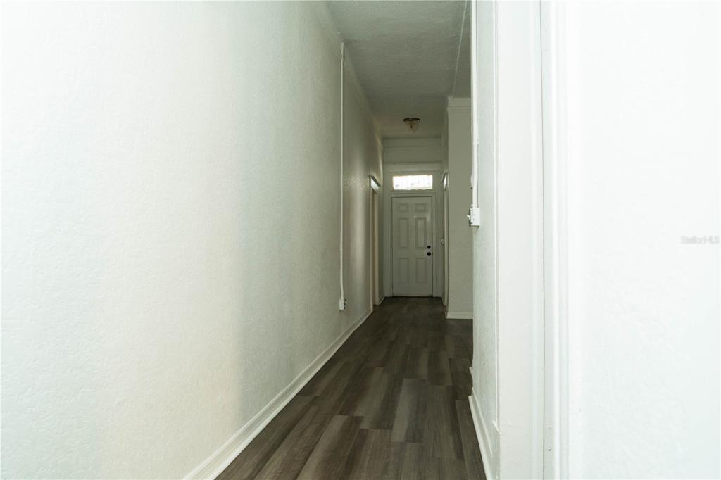 2906 West Chestnut Street, Unit 2 Tampa, FL 33607 - Photo 19 of 28 a view of a bathroom with a sink and a mirror