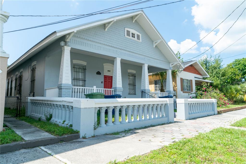 2906 West Chestnut Street, Unit 2 Tampa, FL 33607 - Photo 2 of 28 a view of a house with wooden fence