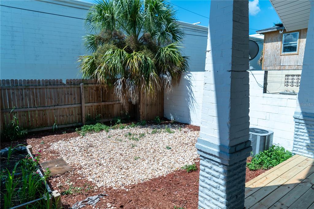 2906 West Chestnut Street, Unit 2 Tampa, FL 33607 - Photo 27 of 28 a view of backyard with potted plants