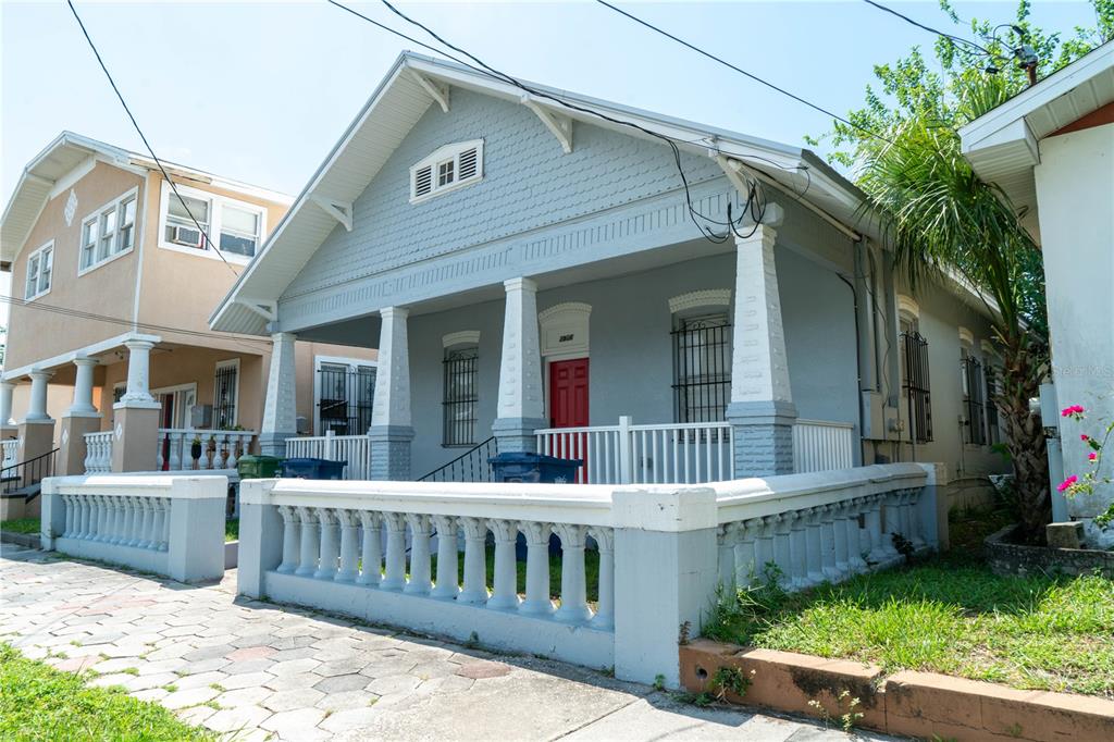 2906 West Chestnut Street, Unit 2 Tampa, FL 33607 - Photo 3 of 28 a front view of a house with garden