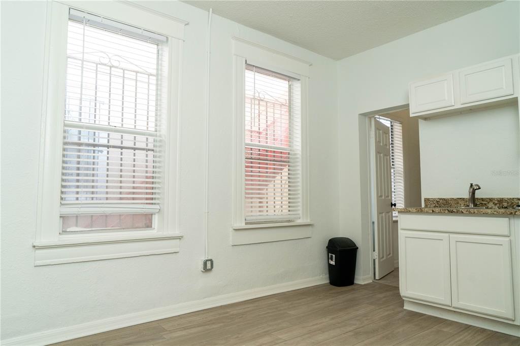 2906 West Chestnut Street, Unit 2 Tampa, FL 33607 - Photo 8 of 28 a kitchen with a window and a sink