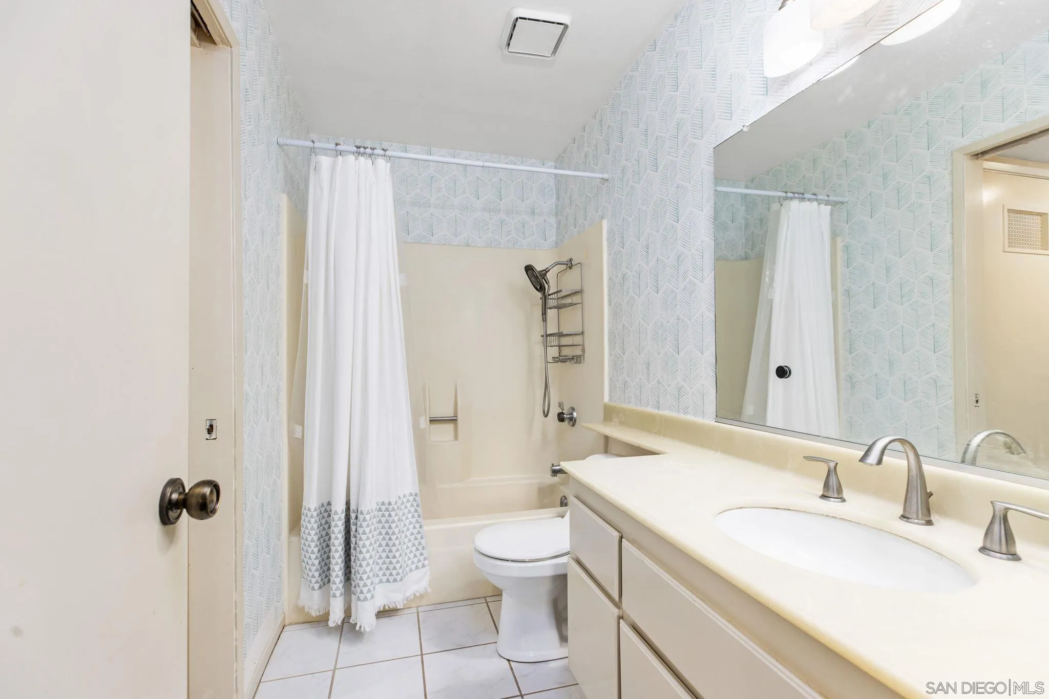 4121 Oak Island Lane Fallbrook, CA 92028 - Photo 14 of 25 a bathroom with a toilet sink and shower
