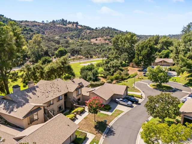 an aerial view of a house with mountain view