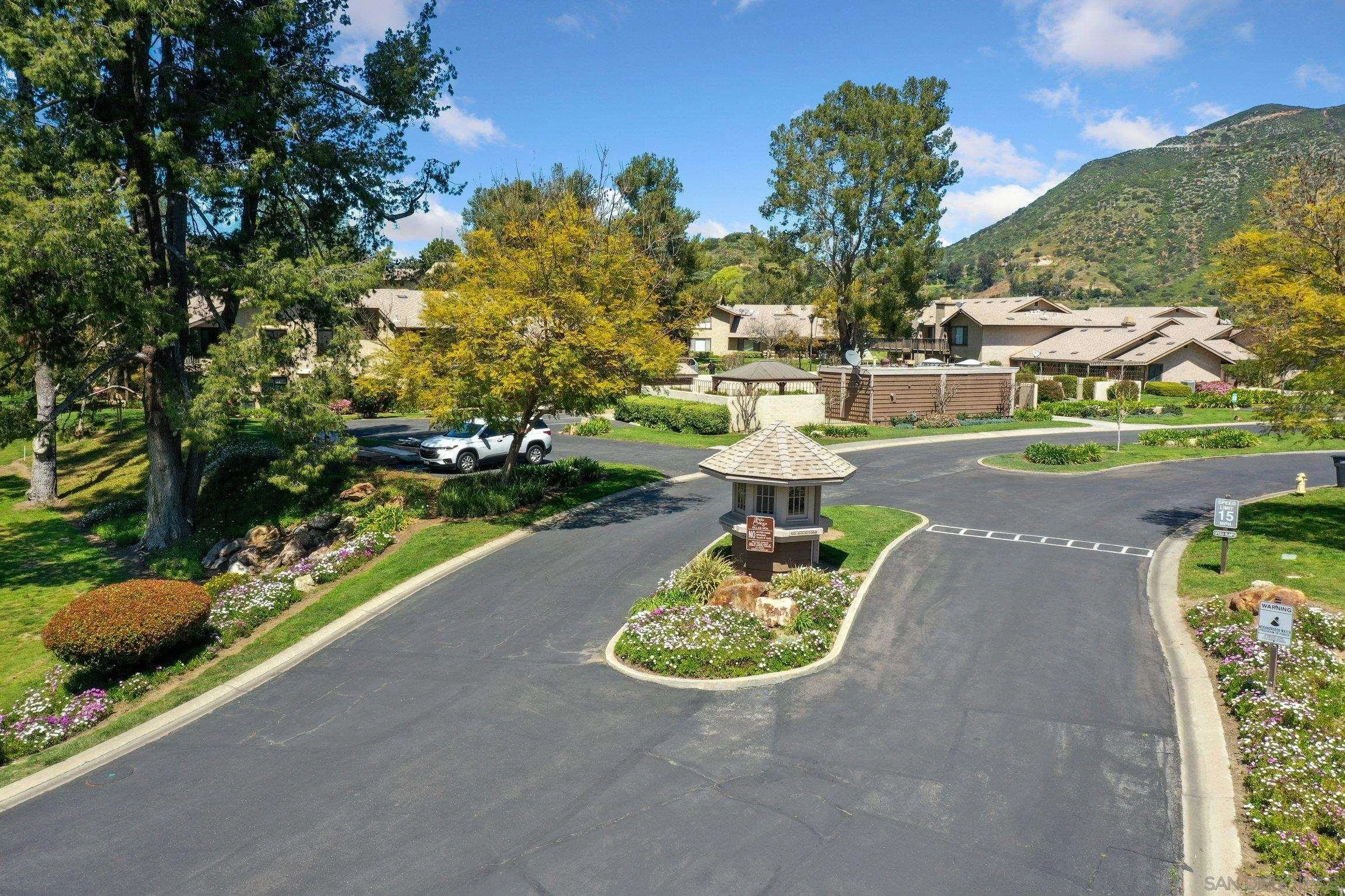 4121 Oak Island Lane Fallbrook, CA 92028 - Photo 21 of 25 a view of a table and chairs in a garden