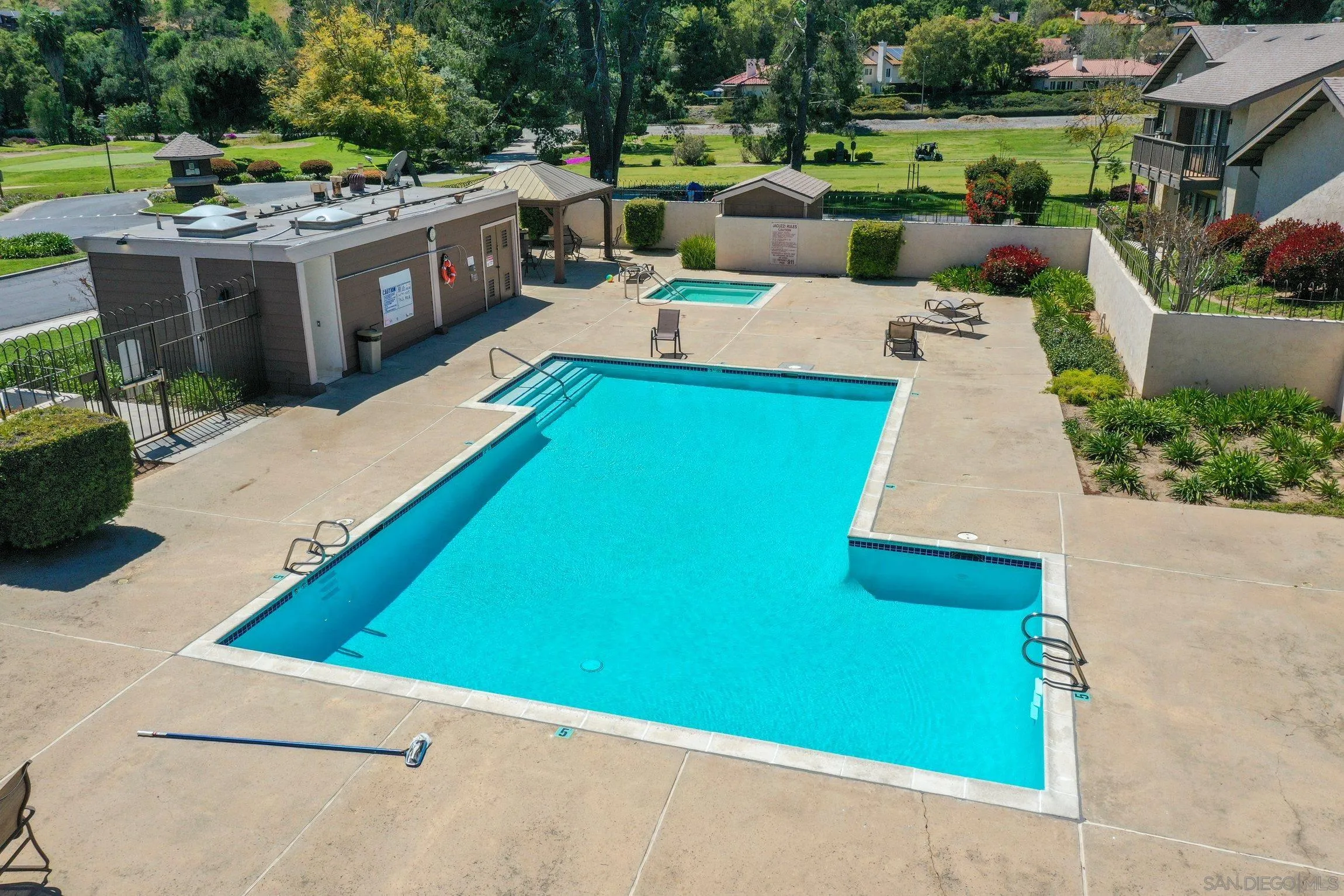 4121 Oak Island Lane Fallbrook, CA 92028 - Photo 22 of 25 a view of a swimming pool with outdoor seating and plants