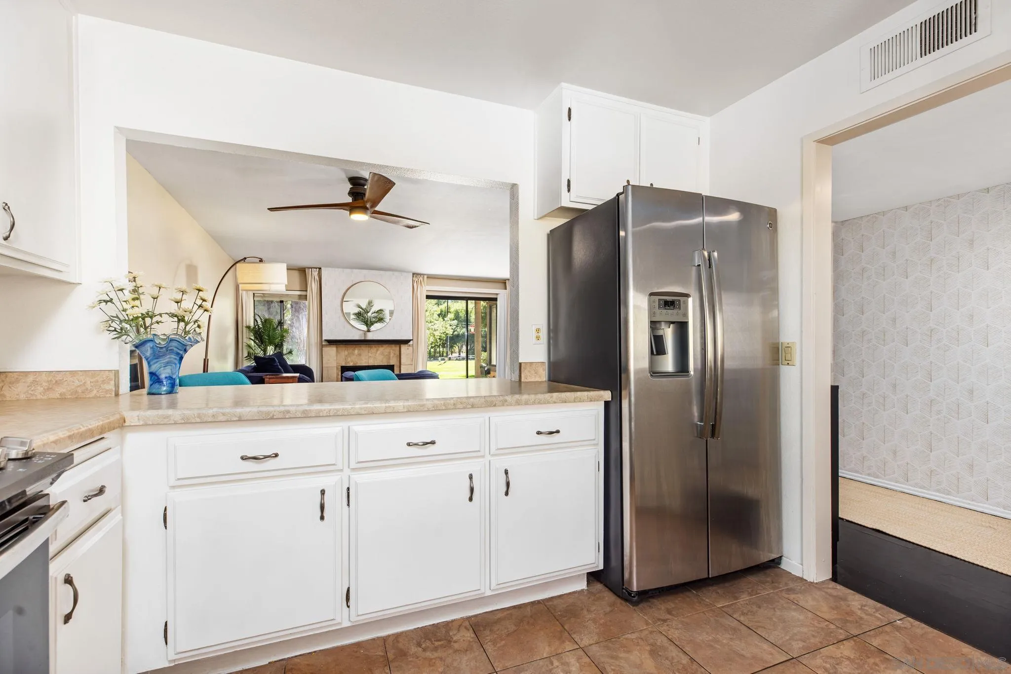 4121 Oak Island Lane Fallbrook, CA 92028 - Photo 6 of 25 a kitchen with stainless steel appliances a refrigerator sink and cabinets