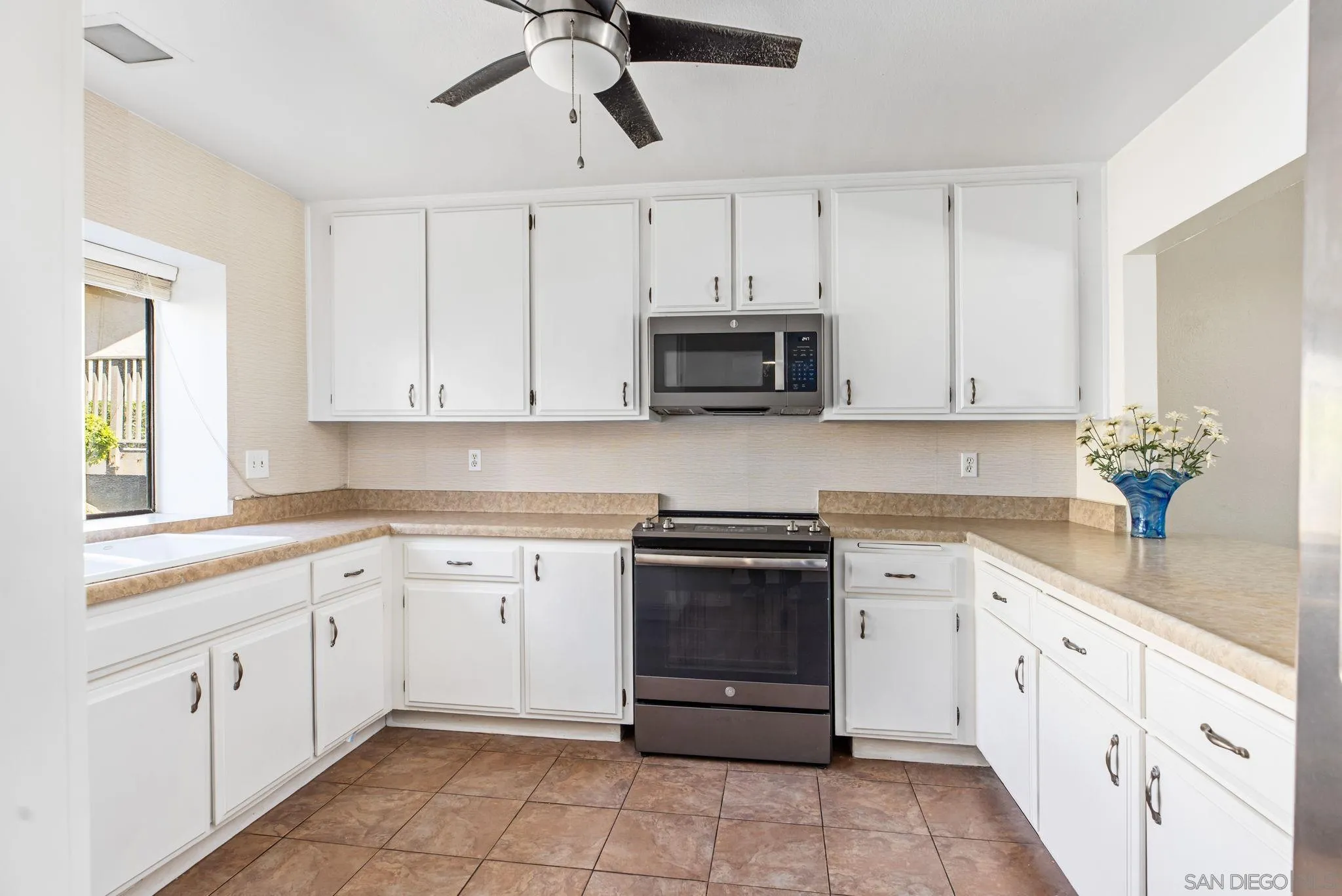 4121 Oak Island Lane Fallbrook, CA 92028 - Photo 7 of 25 a kitchen with cabinets appliances and a sink