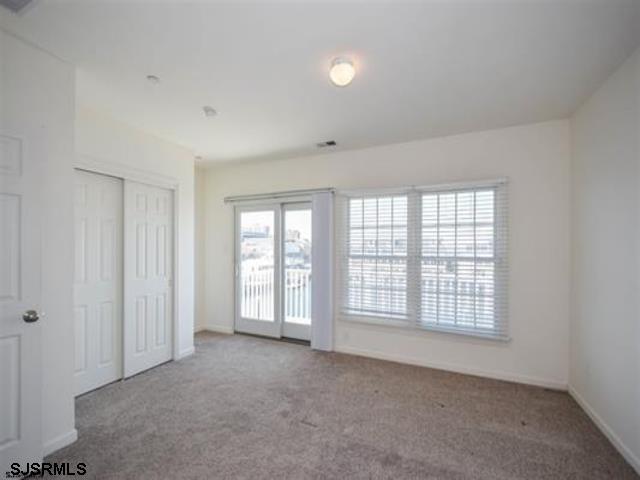 36 Chelsea Court, Unit 36 Atlantic City, NJ 08401 - Photo 13 of 23 an empty room with windows