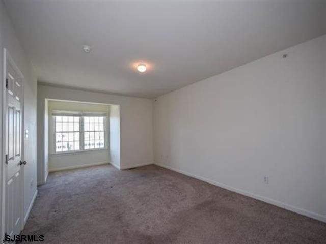 36 Chelsea Court, Unit 36 Atlantic City, NJ 08401 - Photo 22 of 23 an empty room with windows