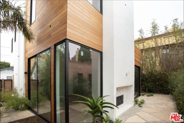 a view of a balcony with potted plants