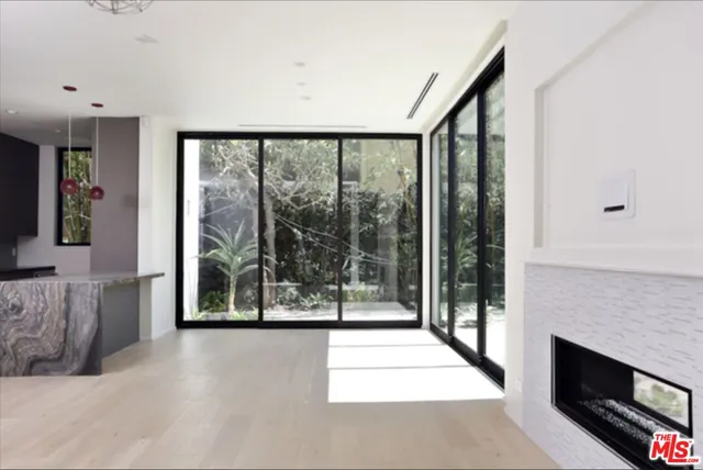 a kitchen with a sink stove and microwave
