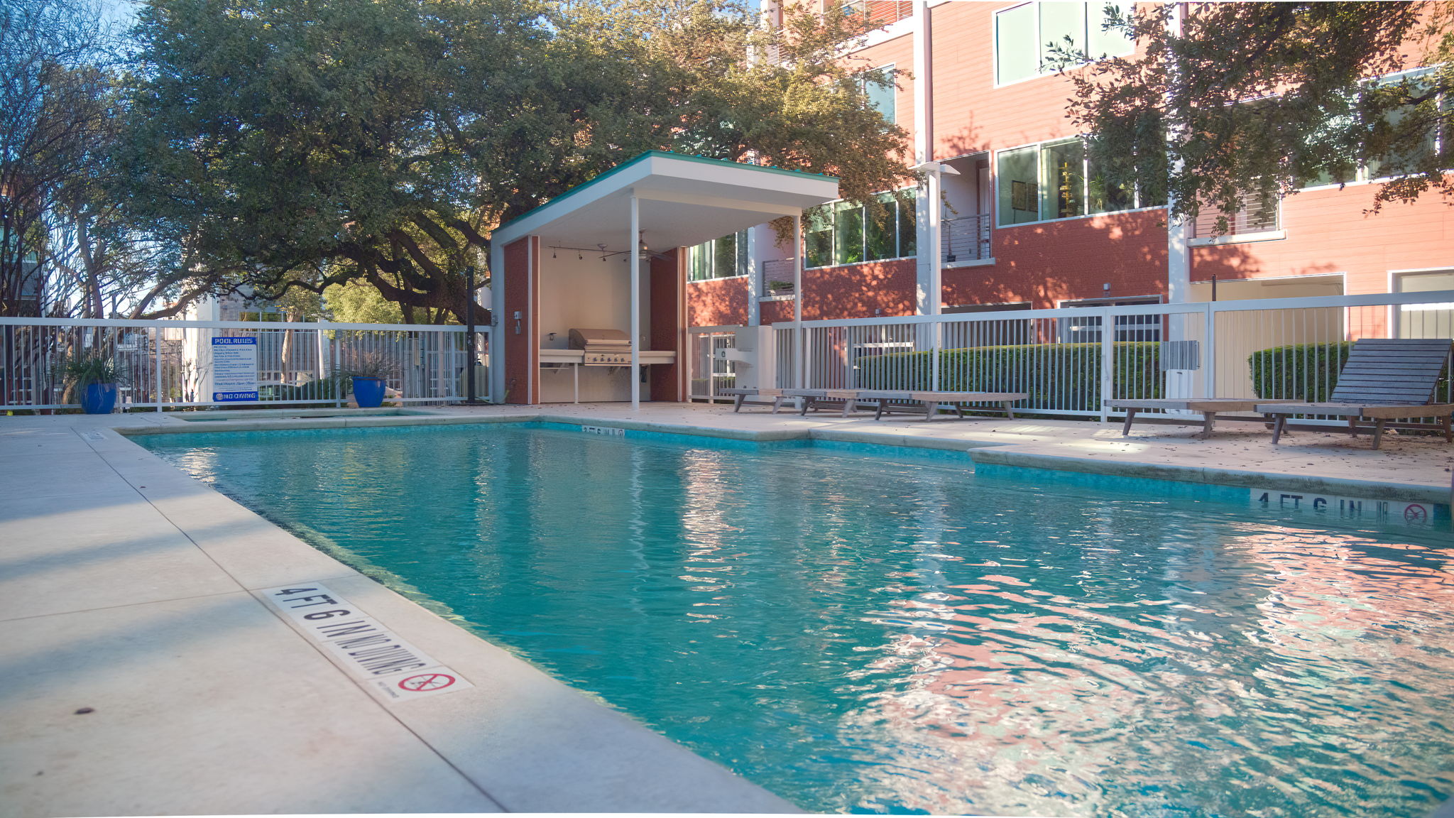 2301 South 5th Street, Unit 5 Austin, TX 78704 - Photo 36 of 39 View of pool area with a covered outdoor kitchen.