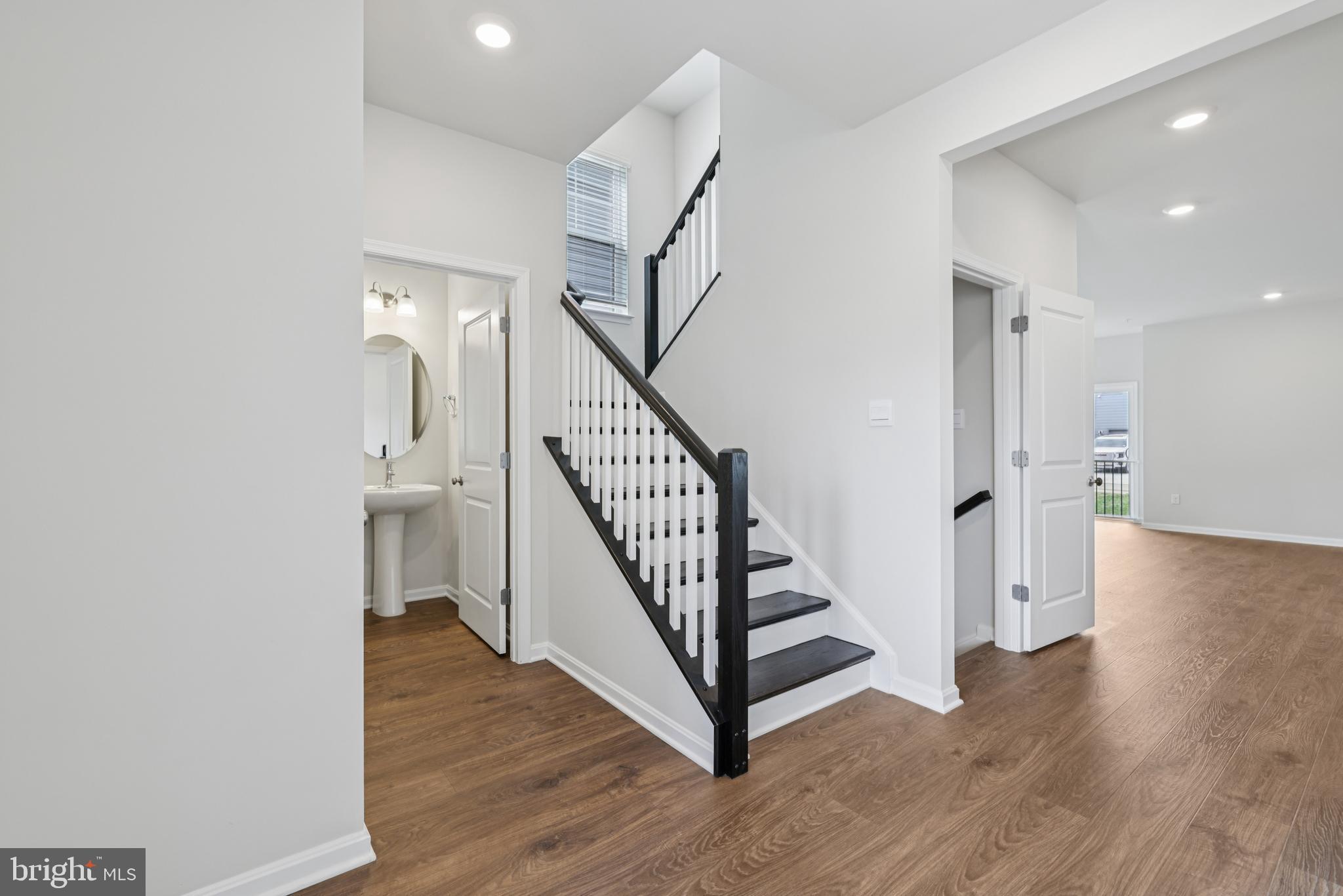 470 Herringbone Way Frederick, MD 21701 - Photo 12 of 61 a view of a hallway with wooden floor and entryway